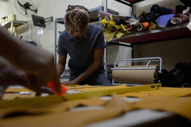 Blue collar workers in a leather shop 35234