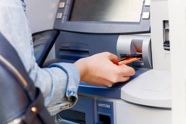 Hand inserting ATM credit card 35957