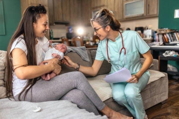 Female doctor at house visit,checking up newborn baby boy New opportunities press