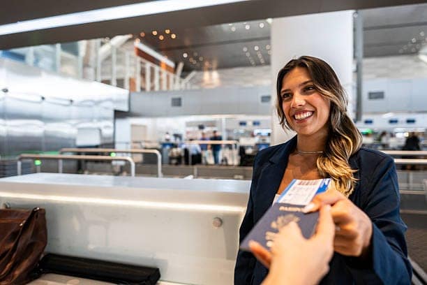 Airline attendant picking the passenger's passport at the airport 40671