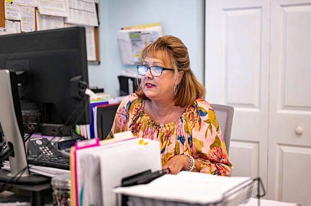 Woman in a mid level professional job at a non-profit New opportunities press